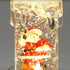 files/9471_BOUGIE-TRANSPARENTE-LUMINEUSE-AVEC-DECORATION-pere-noel-allume-web.jpg